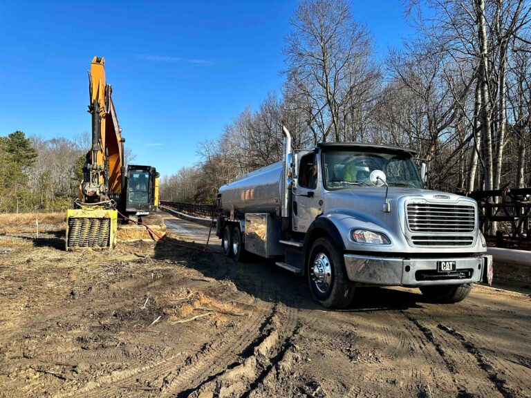 American Energy Supply truck fueling an excavator on a job site